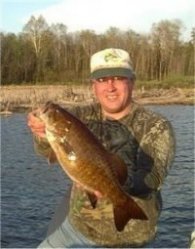 Doug Pirila with 20 inch smallmouth bass, NE Minnesota lake